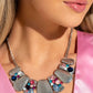 Paparazzi Accessories - Multicolored Mayhem - January 2024 Life of the Party - Multi Necklaces collection of hammered silver plates in various sizes delicately link below the collar, creating a boldly imperfect geometric fringe. Round and teardrop gems in various shades and sizes adorn every other frame in a haphazard pattern for an explosion of sparkle. Features an adjustable clasp closure.  Sold as one individual necklace. Includes one pair of matching earrings.