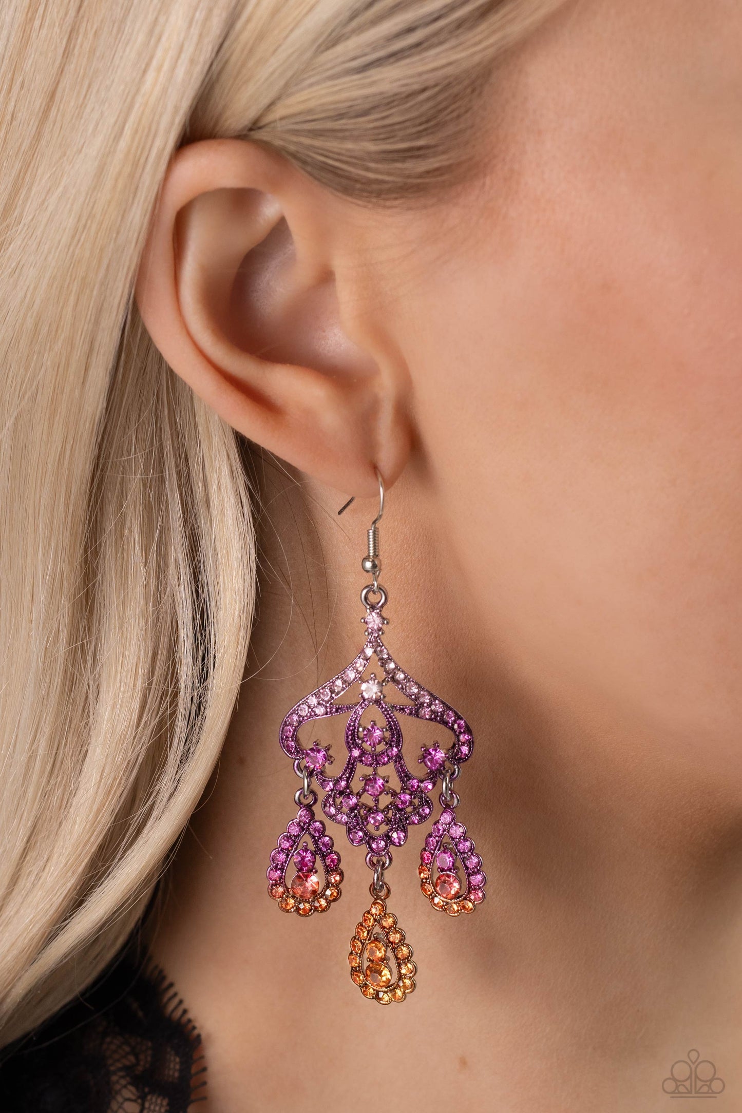 Paparazzi Accessories - Chandelier Command - Multi Earrings three rhinestone-encrusted teardrops drip from the bottom of an ornate decorative frame, creating an elegant fringe. The decorative frame swirls with ombré rhinestones that go from pink to purple to orange shades in varying sizes for a timelessly over-the-top sparkle. Earring attaches to a standard fishhook fitting.  Sold as one pair of earrings.