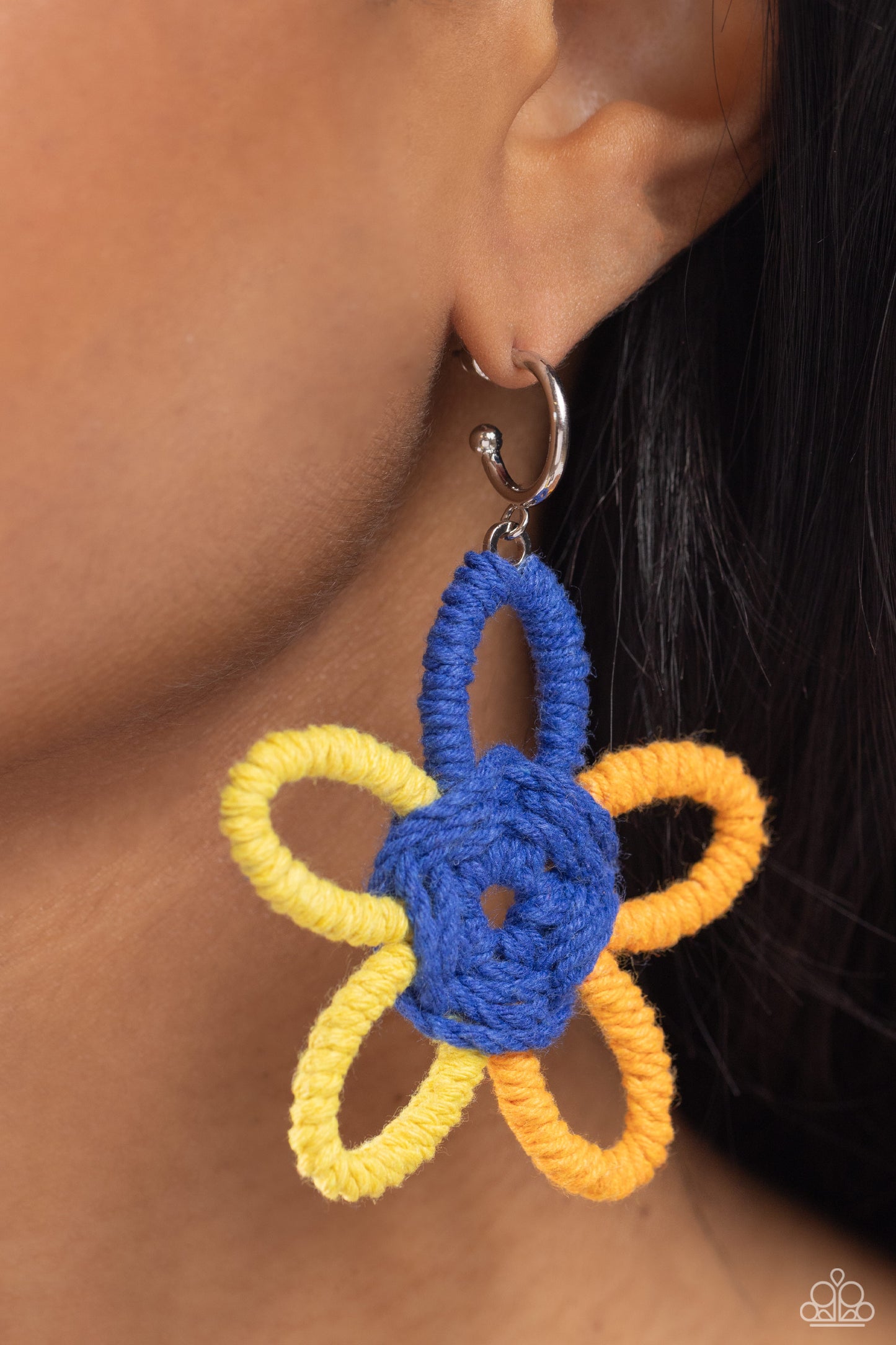 Paparazzi Accessories - Spin a Yarn - Orange Earrings featuring high visibility, Persian Jewel, and orange yarn, an oversized flower swings freely from a dainty silver hoop, creating a playful lure. Earring attaches to a standard post fitting. Hoop measures approximately 1/2" in diameter.  Sold as one pair of hoop earrings.