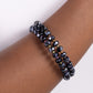 Paparazzi Accessories - Seriously Stellar - Blue Bracelets featuring a faceted shimmer, a glistening collection of faceted metallic blue beads alternate with dainty oil spill studs along a coiled wire, creating a jaw-dropping infinity wrap bracelet around the wrist.  Sold as one individual bracelet.
