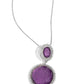 Paparazzi Accessories - Castle Cadenza - Purple Neckencasfeaturing a scratched motif, a large purple gem is encased in a border of rhinestone-dusted silver, as it's suspended from a smaller version of the same design but in an oval shape. The stacked pendant then slides along an elongated silver snake chain for a regal finish. Features an adjustable clasp closure.  Sold as one individual necklace. Includes one pair of matching earrings.