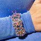Paparazzi Accessories - Shimmering Solo - January 2024 Life of the Party - Orange Bracelets various orange and white rhinestones in round, teardrop, and marquise cuts sparkle atop airy, silver frames, connected to a silver bangle-like bracelet around the wrist for a jaw-dropping dazzle. Features a hinged closure.  Sold as one individual bracelet.