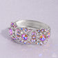 Paparazzi Accessories - Shimmering Solo - January 2024 Life of the Party - Orange Bracelets various orange and white rhinestones in round, teardrop, and marquise cuts sparkle atop airy, silver frames, connected to a silver bangle-like bracelet around the wrist for a jaw-dropping dazzle. Features a hinged closure.  Sold as one individual bracelet.