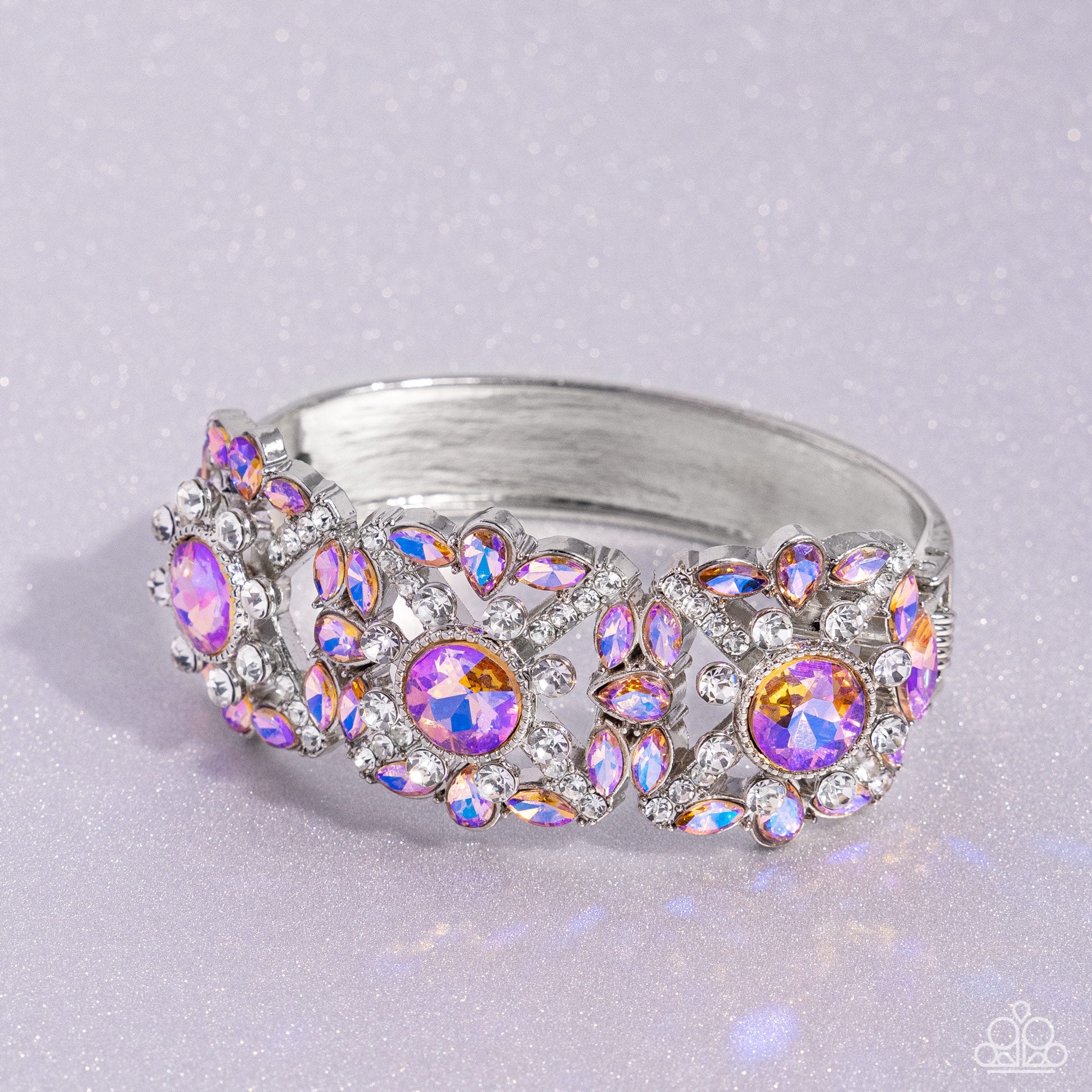 Paparazzi Accessories - Shimmering Solo - January 2024 Life of the Party - Orange Bracelets various orange and white rhinestones in round, teardrop, and marquise cuts sparkle atop airy, silver frames, connected to a silver bangle-like bracelet around the wrist for a jaw-dropping dazzle. Features a hinged closure.  Sold as one individual bracelet.