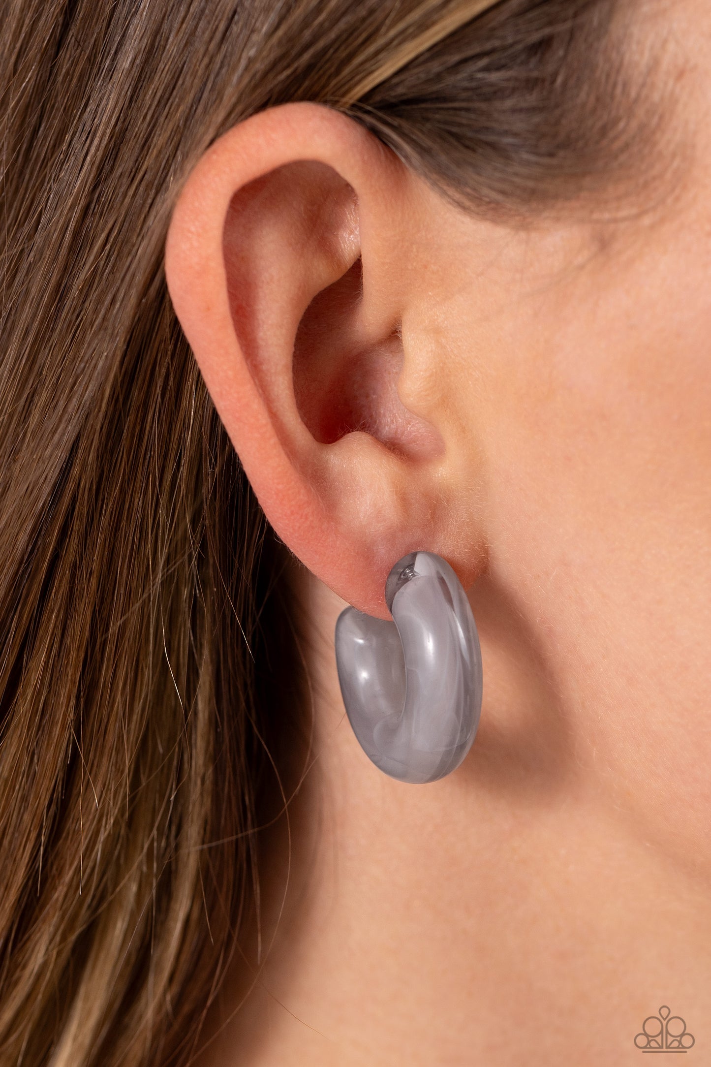 Paparazzi Accessories - Acrylic Acclaim - Silver Hoop Earrings featuring a milky accent, thick gray acrylic frames snugly loop and curl just below the ear for a fashionable finish. Earring attaches to a standard post fitting. Hoop measures approximately 1" in diameter.  Sold as one pair of hoop earrings.