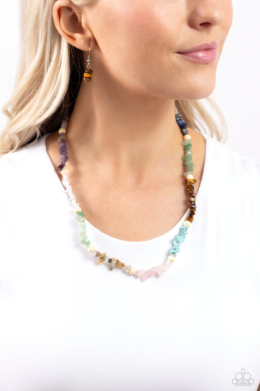 Paparazzi Accessories -Soothing Stones - Multi Necklace infused on an invisible wire, chiseled turquoise, jade, rose quartz, lapis, amethyst, clear white, gray, and tiger's eye stones coalesce around the collar for a colorfully, earthy statement. White wood beads sporadically dot amongst the chiseled collection for an additional artisanal touch. Features an adjustable clasp closure. As the stone elements in this piece are natural, some color variation is normal.