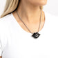 Paparazzi Accessories - Lip Locked - Black Necklaces featuring a glittery finish, an oversized black lip pendant swings from the bottom of a silver link chain below the collar for a romantic statement. White rhinestones border the charm for additional stunning detail. Features an adjustable clasp closure.  Sold as one individual necklace. Includes one pair of matching earrings.