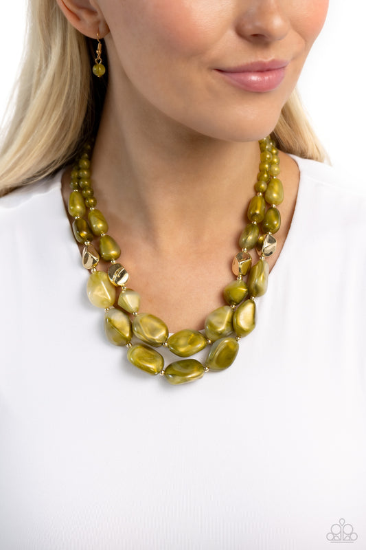 Paparazzi Accessories - Seize the Statement - Green Necklaces varying in shape and opacity, a refreshing collection of sparkle-infused green beads layer below the collar for a boldly colorful look. Accents of faceted gold beads and gold studs are infused throughout the design for a subtle touch of additional sheen. Features an adjustable clasp closure.  Sold as one individual necklace. Includes one pair of matching earrings.