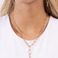 Paparazzi Accessories - Hexagonal Hallmark - Brown Necelongated strand of classic gold chain connects to a strand of elongated gold paperclip chain, creating a contrasting blend of grit. Pressed in a Doe-painted teardrop frame, a peach teardrop gem rests atop a Tender Peach-painted hexagonal pendant, perfectly balancing the design with a spritz of colorful glitz. Features an adjustable clasp closure. Featured inside The Preview at Made for More!