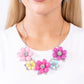 Paparazzi Accessories - Well-Mannered Whimsy - Multi Necklaces dotted with dainty light amethyst, aquamarine, and rose rhinestone centers, dainty silver flowers bloom against a backdrop of glossy acrylic flowers in Aurora Pink, Rose Violet, hot pink, yellow, and Spun Sugar hues. Each flower, varying in size, blossoms across a textured collection of silver leaves below the collar, invoking a festive spirit. Features an adjustable clasp closure.  Sold as one individual necklace.