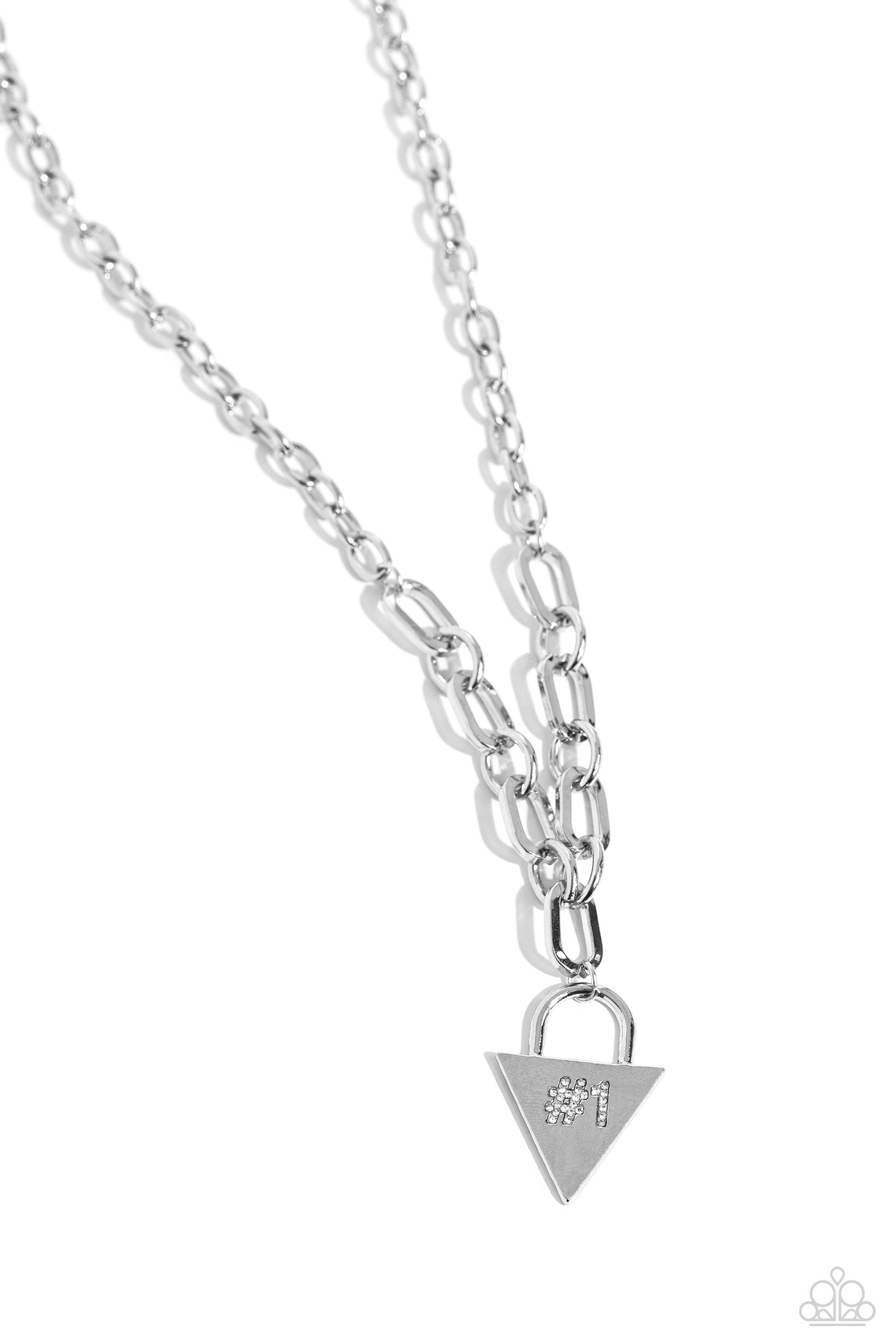 Paparazzi Accessories - Your Number One Follower - White Rhinestones Necklaces dangling from a collection of oversized, curved links connected to a silver link chain, a locket-inspired pendant rests in the shape of a triangle. Embossed in white rhinestones, a #1 gleams from the center of the pendant for a sports-inspired finish. Features an adjustable clasp closure.  Sold as one individual necklace. Includes one pair of matching earrings.
