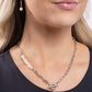 Paparazzi Accessories - Courting Cosmopolitan - White Necklaces an elegant lariat closure, an oversized, baroque white pearl cascades from the bottom of a silver paperclip chain for a refined fashion. Dainty, glossy baroque pearl beads are infused along one side of the silver chain.  Sold as one individual necklace. Includes one pair of matching earrings.