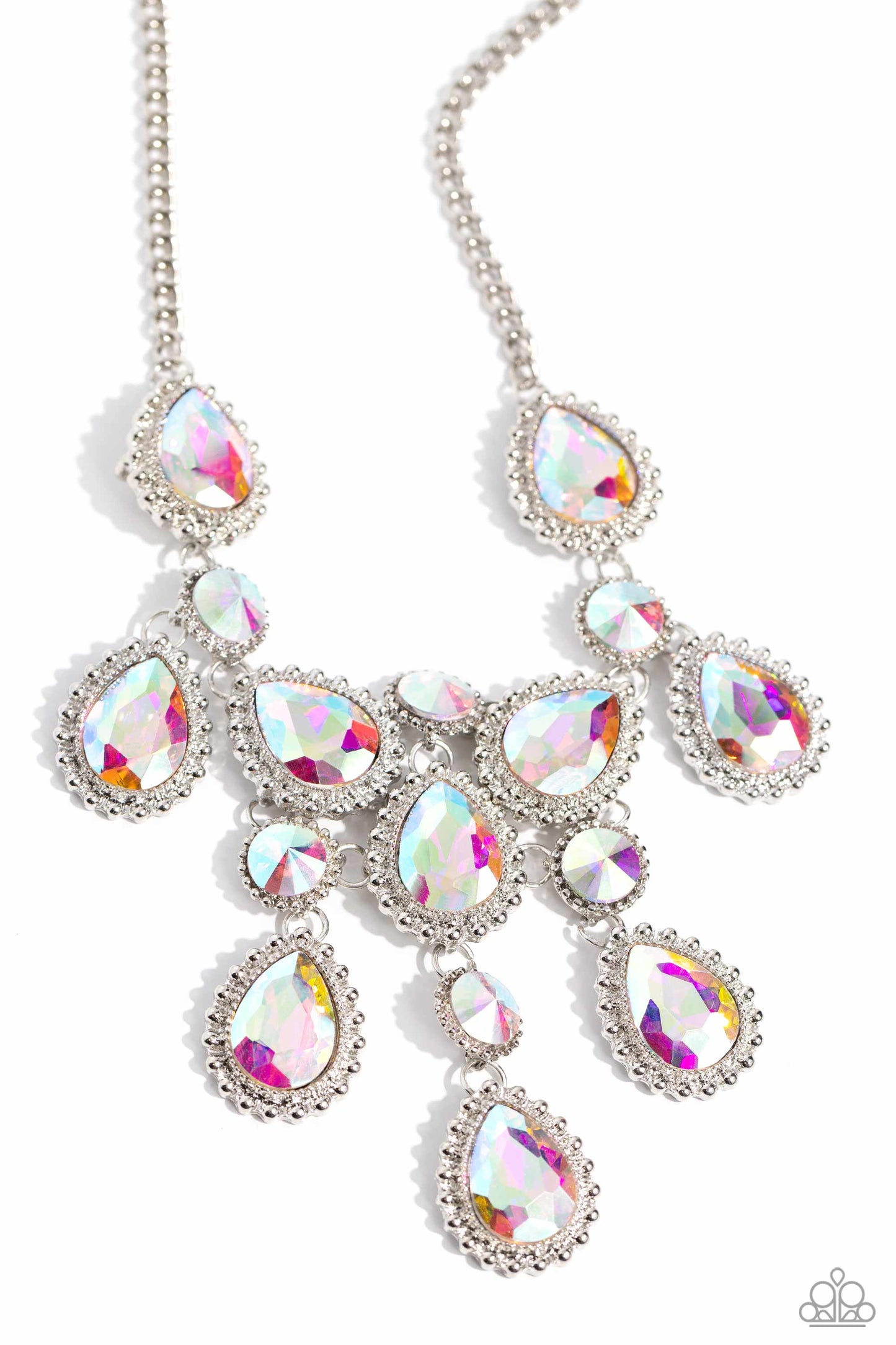 Paparazzi Accessories - Dripping in Dazzle - December 2023 Life of the Party Multi Necklaces an explosion of round, teardrop, and marquise-cut gems in varying sizes bordered by tactile silver studs cluster together to create a glittery iridescent showcase down the neckline. Featuring various shades of iridescence, each gem reflects light off of its faceted surface emitting further glitz and glam. Features an adjustable clasp closure. Due to its prismatic palette, color may vary.