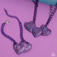 Paparazzi Accessories - Lowkey Lovestruck - Purple Jewelry Sets dipped in an electric purple hue, a strand of bulky chain gives way to three heart frames below the collar. Dotted with tactile electric purple studs, the interlocked heart frames feature various pink, blue, purple, and white rhinestones for a timeless finish. Features an adjustable clasp closure. Sold as one individual necklace. Includes one pair of matching earrings.