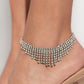 <p data-mce-fragment="1">sassy curtain of mismatched white rhinestone-encrusted silver box chains tapers from the bottom of a double-stranded dramatic row of glassy white rhinestones delicately pressed in silver square fittings. The exaggerated fringe cascades around the ankle, resulting in a dauntless attitude that demands attention with every swish. Features an adjustable clasp closure.</p> <p data-mce-fragment="1"><i data-mce-fragment="1">Sold as one individual anklet.</i></p>