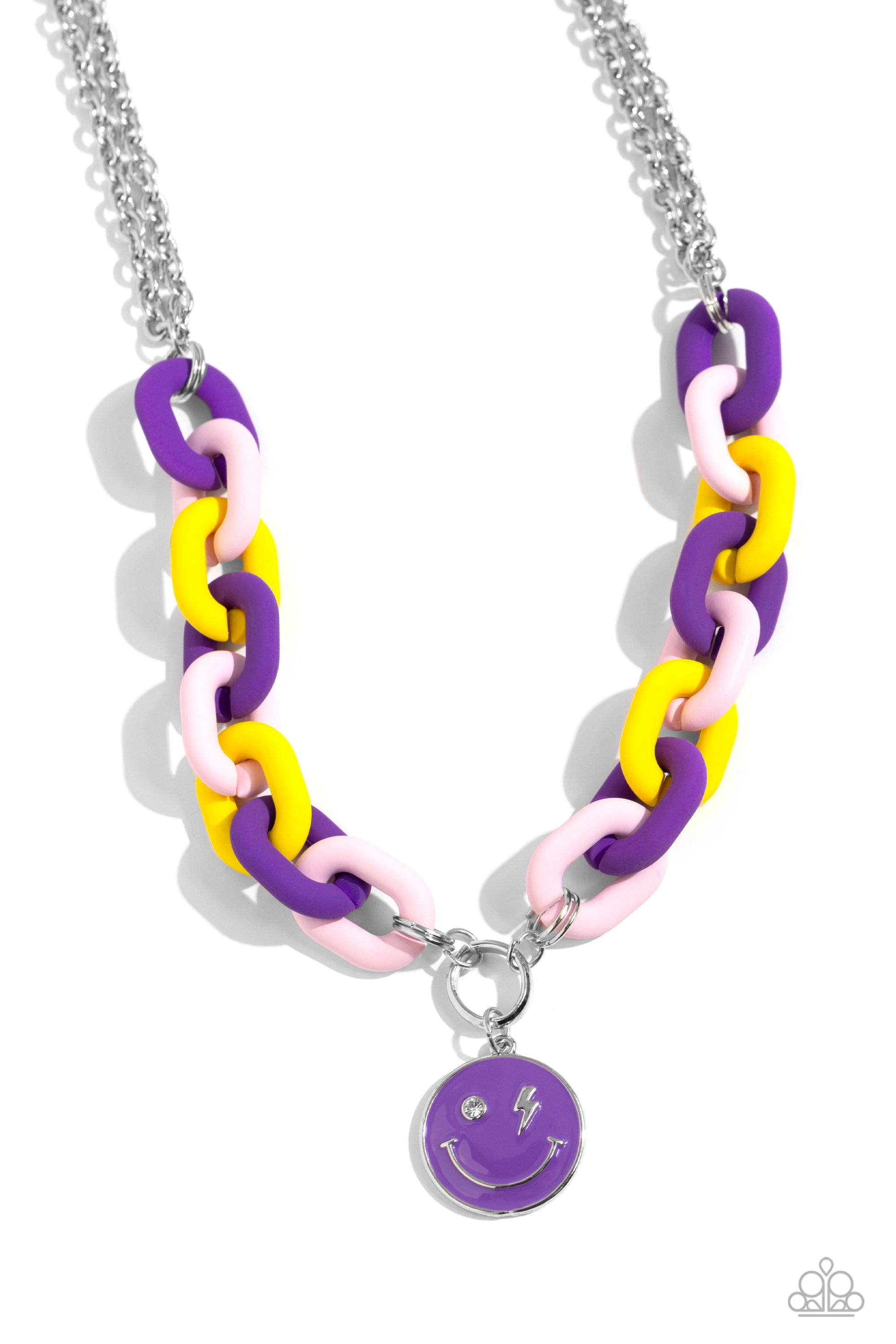 Paparazzi Accessories - Speed Smile - Purple Jewelry Sets two strands of silver chain give way to a strand of oversized purple, baby pink, and yellow acrylic links for a colorful statement. A purple-painted smiley face pendant, with a lightning bolt for one eye, cascades from the colorful links for an exaggerated touch of personality. Features an adjustable clasp closure.