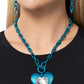 <p data-mce-fragment="1">Bordered in linear textures, an oversized white heart gem is pressed into an electric blue heart frame below the collar. The flirtatious pendant attaches to a thick, electric blue chain, resulting in a modern-inspired romance. Features a lariat closure.</p> <p data-mce-fragment="1"><i data-mce-fragment="1">Sold as one individual necklace. Includes one pair of matching earrings.</i></p>