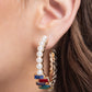 <p data-mce-fragment="1">Paparazzi Accessories - Modest Maven - Gold Earrings floating atop sleek gold fittings, a glamorous collection of classic white pearls, interrupted by a collection of staggered multicolored emerald-cut gems, delicately coalesces around a gold hoop for a sparkly statement. Earring attaches to a standard post fitting. Hoop measures approximately 1 3/4" in diameter.</p> <p data-mce-fragment="1"><i data-mce-fragment="1">Sold as one pair of hoop earrings.</i></p>