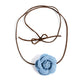 Paparazzi Accessories - Floral Folktale - Brown Choker Necklaces Featuring tactile detail, a three-dimensional, oversized denim rose slides along strips of brown suede, creating a Western floral-inspired centerpiece around the collar. Features an adjustable claspSold as one individual choker necklace. Includes one pair of matching earrings.