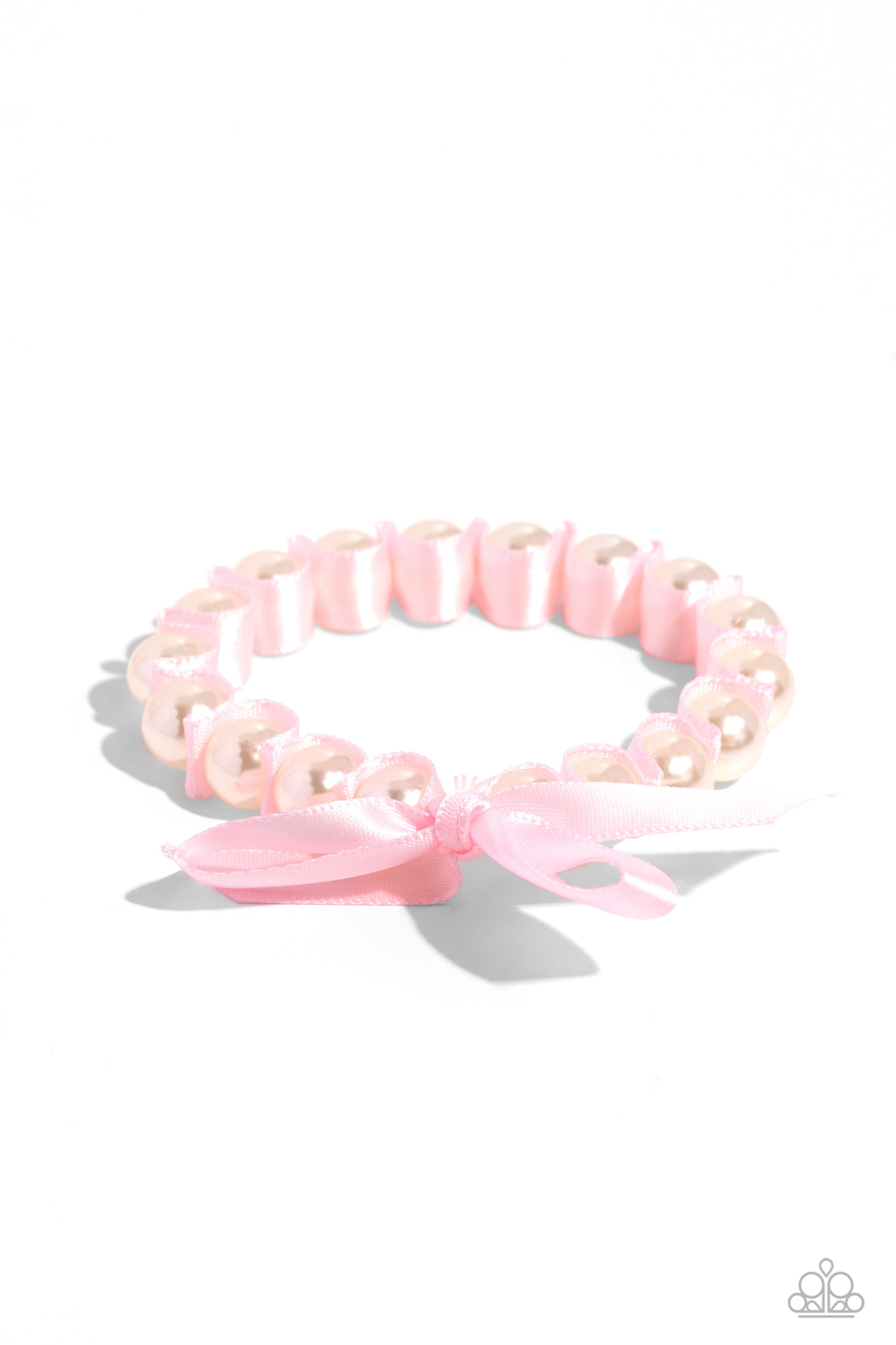 <p>Paparazzi Accessories - Ribbon Rarity - Pink Pearl Bracelets delicately wrapped in the folds of a baby pink ribbon, gleaming white pearls are infused along an elastic stretchy band around the wrist for a feminine, girly statement.</p> <p><i>Sold as one individual bracelet.</i></p>