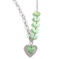 Paparazzi Accessories - Heart of the Movement - Green Necklaces a strand of opalescent green hearts collides with a single strand of paperclip chain to create an abstract blend of grit and color. A larger silver heart offsets the opalescent sheen of the green hearts that lay above it, perfectly balancing the contrasting design. Features an adjustable clasp closure.</p> <p data-mce-fragment="1"><i data-mce-fragment="1">Sold as one individual necklace. Includes one pair of matching earrings.