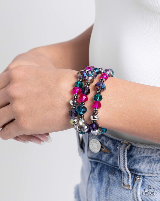 <p data-mce-fragment="1">Paparazzi Accessories - Stack of Glass - Multi Bracelets infused along elastic stretchy bands, a collection of highly-faceted multicolored beads in various shades and silver and gunmetal beads stack along the wrist for a pop of color.</p> <p data-mce-fragment="1"><i data-mce-fragment="1">Sold as one set of three bracelets.</i></p>
