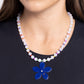 Paparazzi Accessories - Nostalgic Novelty - Blue Necklaces infused along an invisible string around the neckline, a collection of milky white beads alternates with yellow, Kohlrabi, Royal Blue, purple, orange, white, coral, and light blue seed beads. Featuring an iridescent rhinestone center and an orange rhinestone accent, a Royal Blue acrylic flower dangles from the center of the display for a nostalgic finish. Features an adjustable clasp closure. Due to its prismatic palette, color may vary.