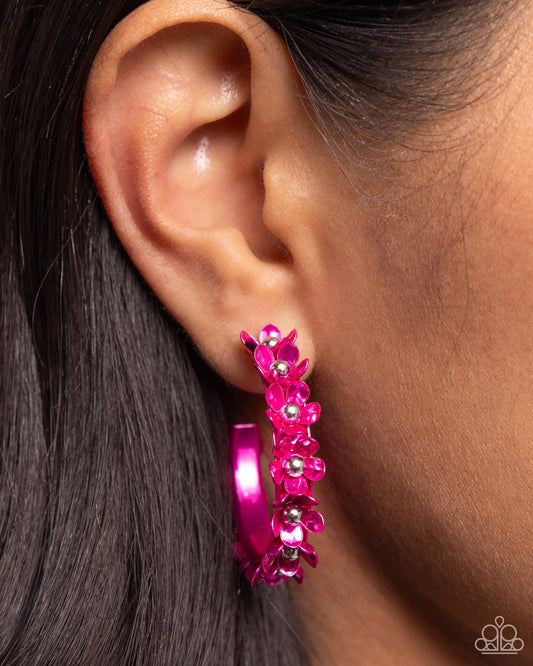 <p>Paparazzi Accessories - Fashionable Flower Crown - Pink Hoop Earrings dipped in a hot pink hue, a hollowed-out hoop curls around the ear. Featuring silver beaded centers, metallic hot pink flowers bloom along the curl of the hollow of the hoop for a fashionable display. Earring attaches to a standard post fitting. Hoop measures approximately 1 1/4" in diameter.</p> <p><i>Sold as one pair of hoop earrings.</i></p>