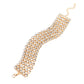 Paparazzi Accessories - GLASSY Gallery - Gold Bracelets suspended from sleek, dainty gold bars, five linked rows of glassy white rhinestones stack into a blinding display around the wrist for a jaw-dropping look. Features an adjustable clasp closure.  Sold as one individual bracelet.
