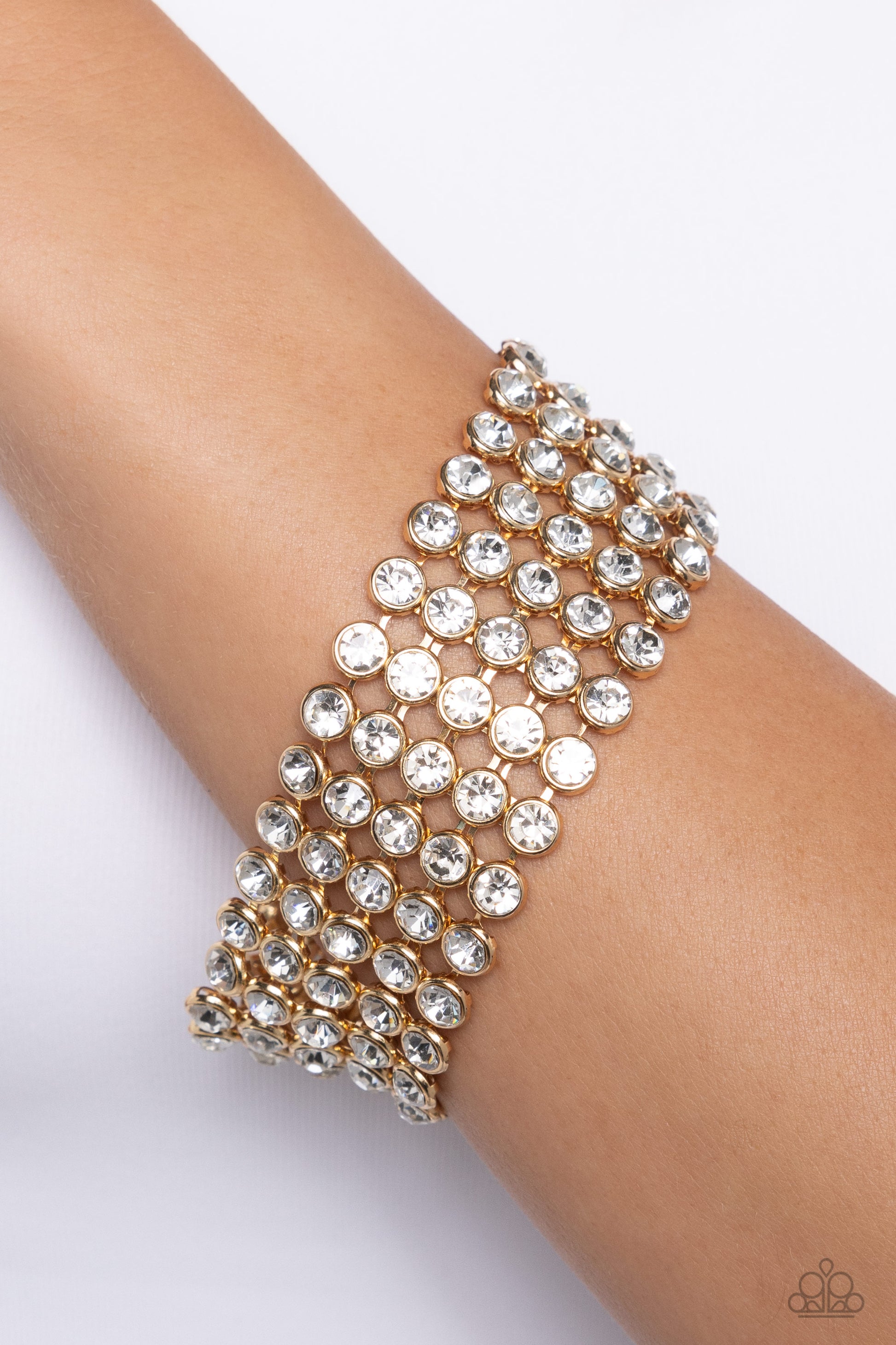 Paparazzi Accessories - GLASSY Gallery - Gold Bracelets suspended from sleek, dainty gold bars, five linked rows of glassy white rhinestones stack into a blinding display around the wrist for a jaw-dropping look. Features an adjustable clasp closure.  Sold as one individual bracelet.
