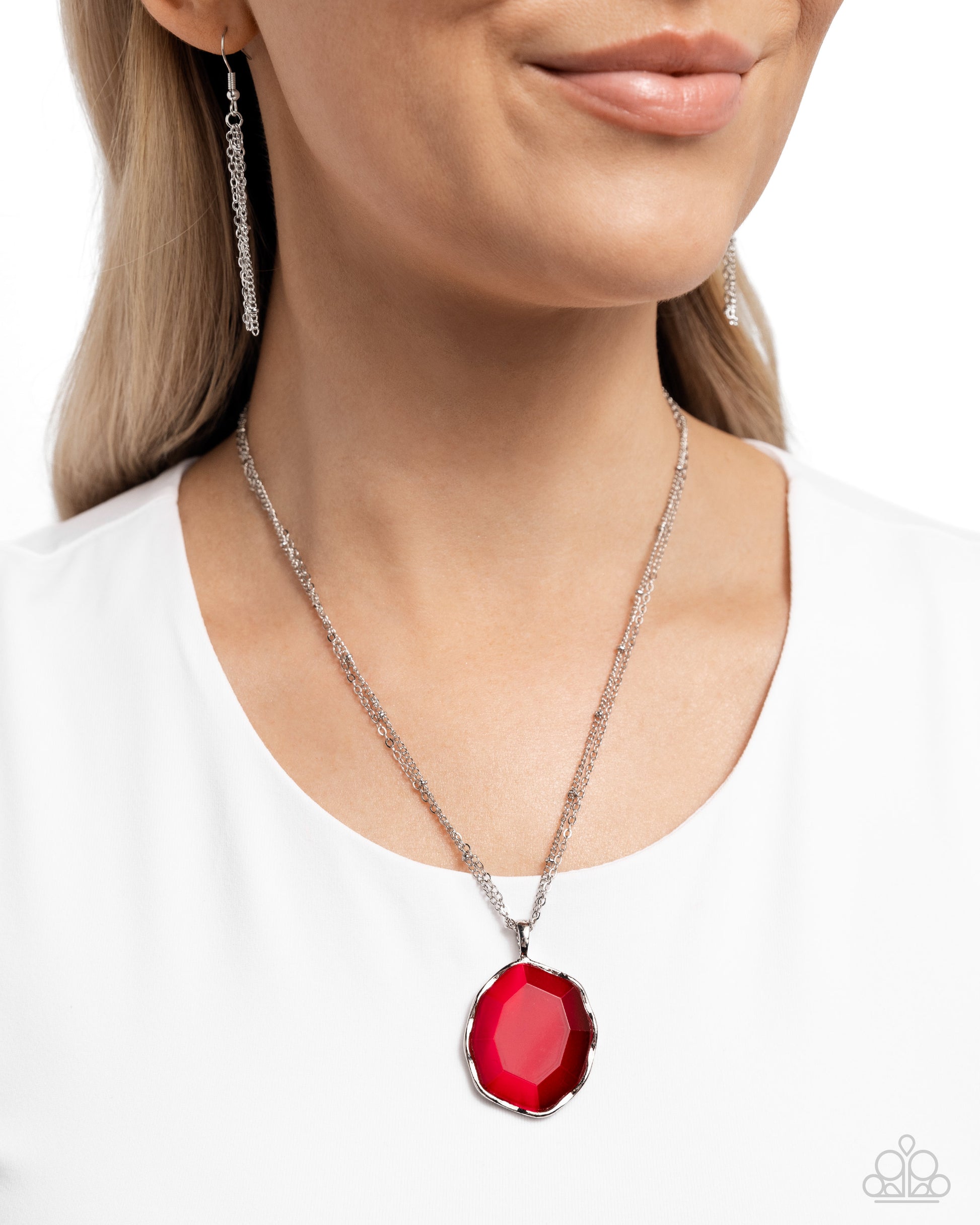 Paparazzi Accessories - Showstopping Season - Red Necklaces gliding along a double silver chain and satellite chain, a faceted red oval is set in an abstract silver frame for a pop of refined color below the chest. Features an adjustable clasp closure.  Sold as one individual necklace. Includes one pair of matching earrings.