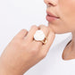 <p>Paparazzi Accessories - Top- SHELL Shine - Gold Rings featured in the center of an airy gold band, a white rosette is formed from shiny shell petals for a blooming basic atop the finger. Features a stretchy band for a flexible fit.</p> <p><i>Sold as one individual ring.</i></p>