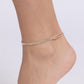 <div class="sku" data-v-510a33b4="">Paparazzi Accessories - Dainty Declaration - Gold Anklets s<span style="font-size: 1rem;">et in gold square fittings, two strands of white rhinestones coalesce around the ankle for a simply shimmering statement. Features an adjustable clasp closure.</span></div> <div class="description" data-v-510a33b4=""> <p><i>Sold as one individual anklet.</i></p> </div>