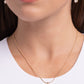 Set in pronged gold fittings, a faceted, glittery white gem glides along a gold snake chain for a beautiful basic. Features an adjustable clasp closure.  Sold as one individual necklace. Includes one pair of matching earrings.