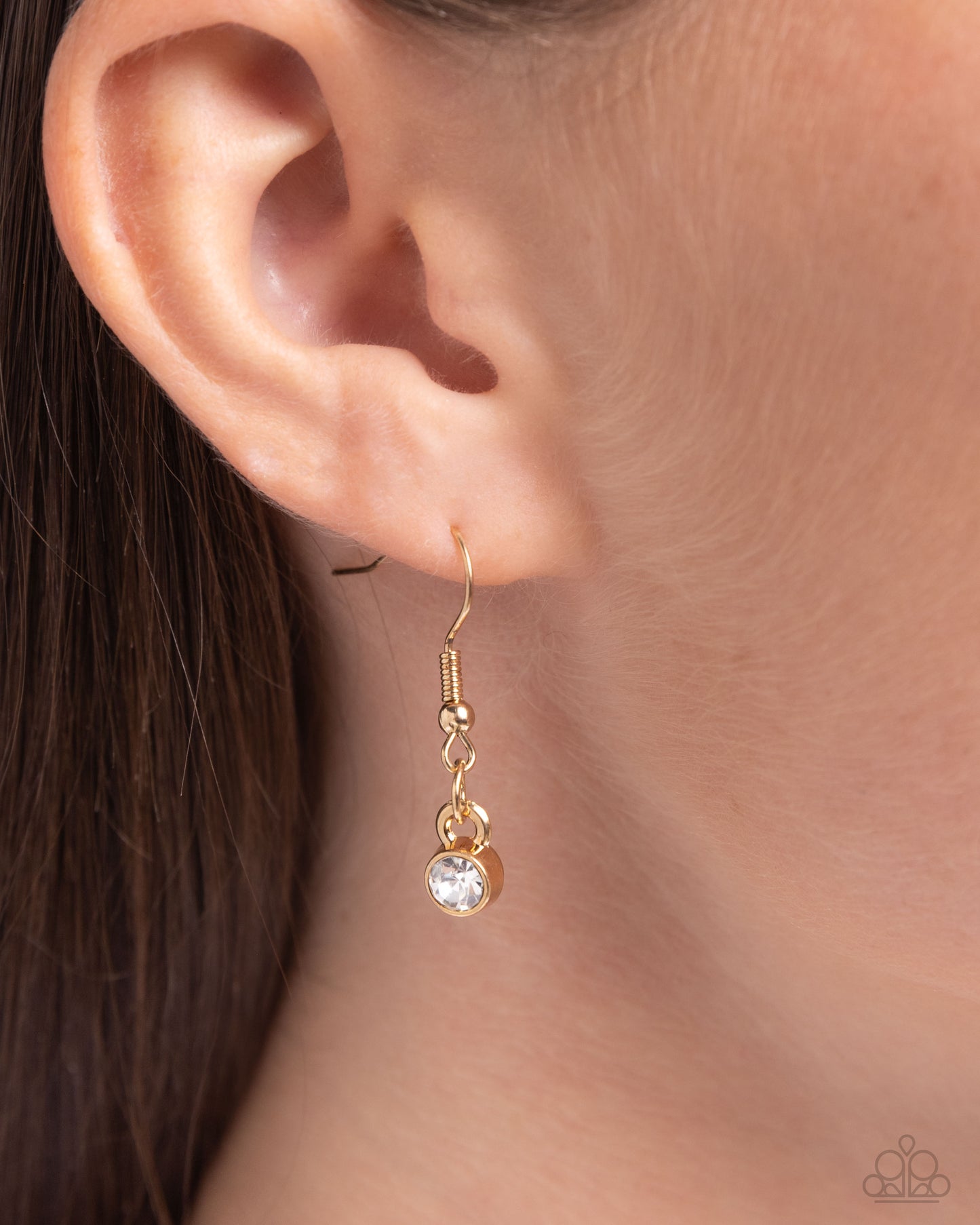 Set in pronged gold fittings, a faceted, glittery white gem glides along a gold snake chain for a beautiful basic. Features an adjustable clasp closure.  Sold as one individual necklace. Includes one pair of matching earrings.