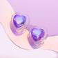 Paparazzi Accessories - Heart-Pounding Haute - Purple Earrings featuring a faceted finish, a thick clear frame gathers around a purple UV shimmery heart center, creating a romantic display. Earring attaches to a standard post fitting.  Sold as one pair of post earrings.