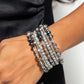 <p>Paparazzi Accessories - Sizzling Stack - Multi Bracelets threaded along a coiled wire, silver beads, white rhinestones in silver square fittings, and oil spill, blue, silver, and transparent faceted beads curl around the wrist, creating an eye-catching, infinity wrap-style bracelet around the wrist.</p> <p><i>Sold as one individual bracelet.</i></p>