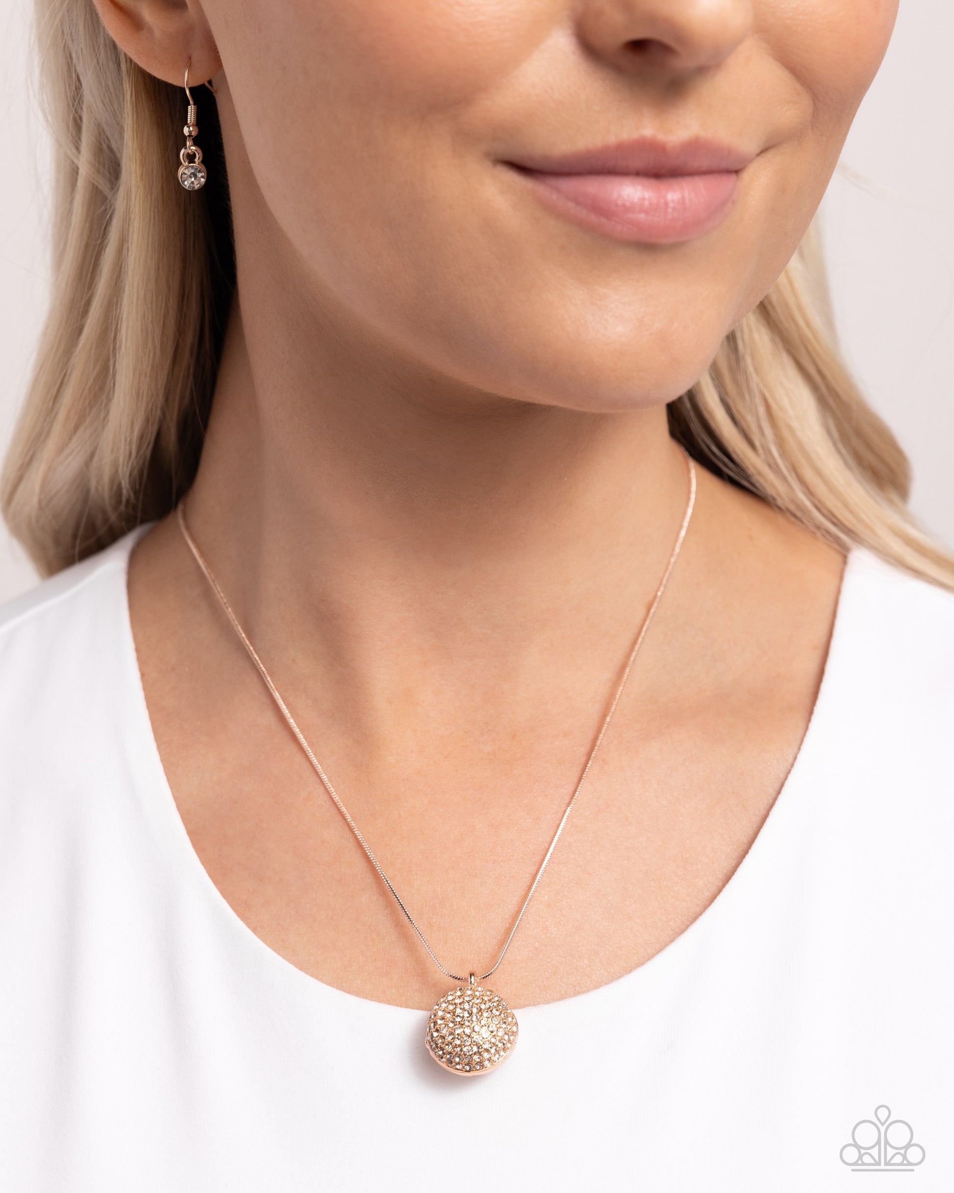 Paparazzi Accessories - Bedazzled Bravado - Rose Gold Necklaces&nbsp; in shimmery white rhinestones, a rose gold ornament-like sphere glides along a rose gold snake chain for a dazzling basic. Features an adjustable clasp closure.  Sold as one individual necklace. Includes one pair of matching earrings.
