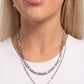 Paparazzi Accessories - Lovely Layers - Multi Necklace featuring multicolored iridescent rhinestones, a pendant spelling out the word "LOVE" is attached to the lowermost strand of two mismatched silver chain layers for a radiantly romantic statement. Features an adjustable clasp closure. Due to its prismatic palette, color may vary.  Sold as one individual necklace. Includes one pair of matching earrings.