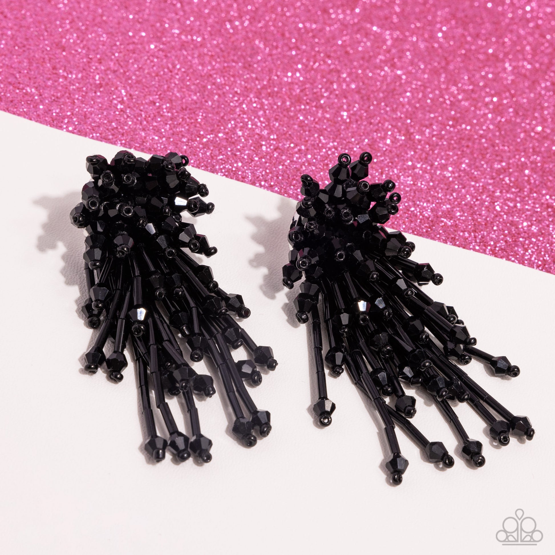 An explosion of faceted, shiny black beads and bars elongate into a modern, edgy display. Earring attaches to a standard post fitting.  Sold as one pair of post earrings