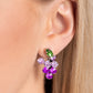 Pronged in silver fittings, a collection of round light purple rhinestones fade to darker purple rhinestones with a solitaire green marquise-cut leaf for an ombré, glittery grape-inspired display. Earring attaches to a standard post fitting.  Sold as one pair of post earrings.