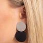 Paparazzi Accessories - Leather Leader - Black Clip-On Earrings an&nbsp;oversized silver disc gives way to an even larger disc of black leather for a badlands basic. Earring attaches to a standard clip-on fitting.  Sold as one pair of clip-on earrings.