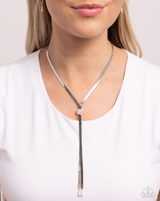 <p>Paparazzi Accessories - Corporate Cascade - Pink Necklaces a highly reflective collection of dainty, faceted pink beads sits along high-impact strands of glistening silver herringbone chain for a timeless tassel. A trio of additional pink beads dangles below the exaggerated chains for additional color. Features an adjustable clasp closure.</p> <p><i>Sold as one individual necklace. Includes one pair of matching earrings.</i></p>