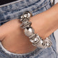 Paparazzi Accessories - Coiled Confidence - Silver Bracelets infused along an industrial abstract stretchy chain, a collection of interlocking silver rings, oversized silver beads, and white gem-encrusted silver accents twists and coils along the wrist for a charismatically confident look.  Sold as one individual bracelet.