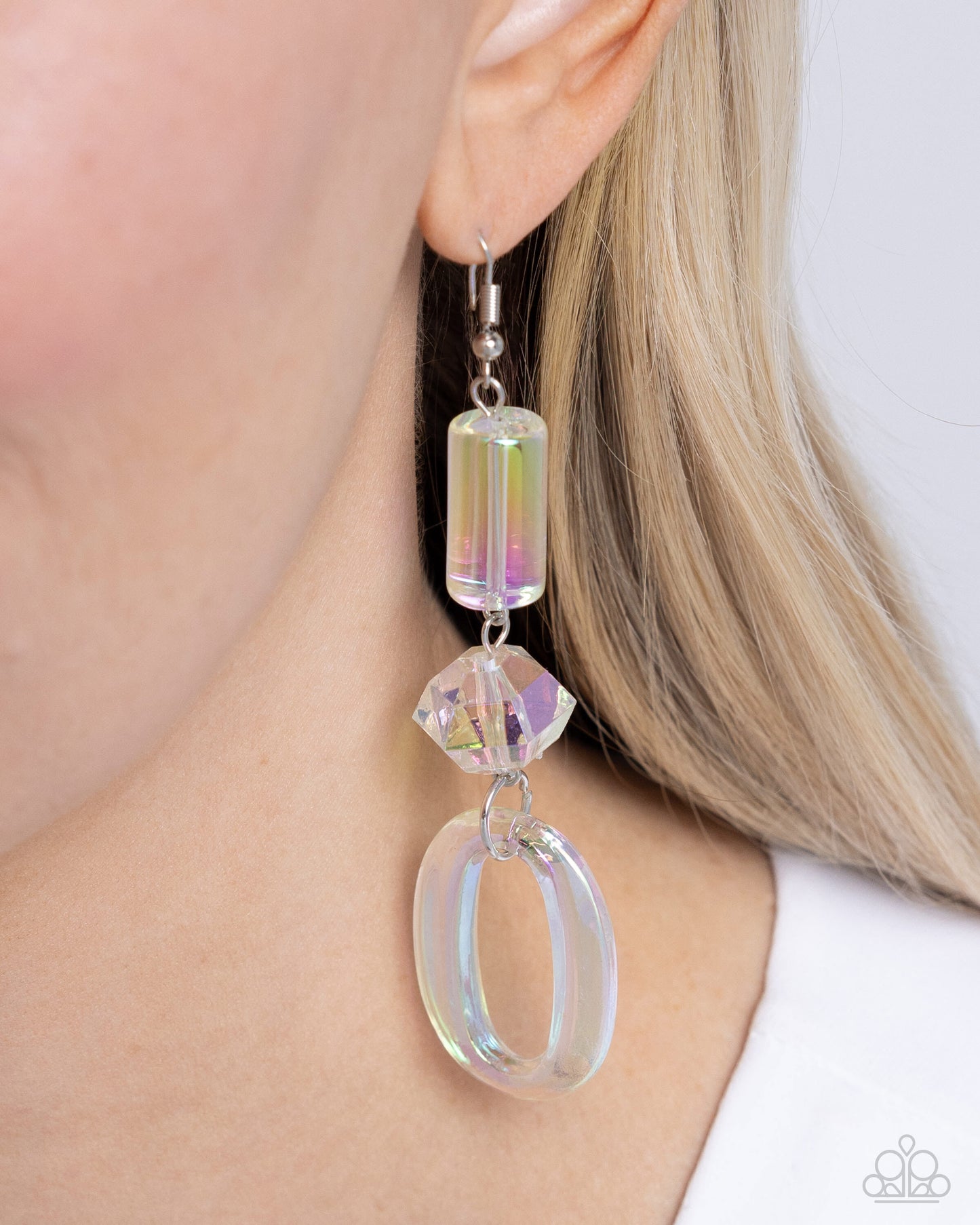 <p>Paparazzi Accessories - Iridescent Infatuation - Multi Earrings featuring an iridescent hue, a cylindrical bead, a highly-faceted chunky bead, and an oversized oval elongate down the ear for a reflective, radiant display. Earring attaches to a standard fishhook fitting. Due to its prismatic palette, color may vary.</p> <p><i>Sold as one pair of earrings.</i></p>