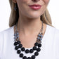 <p data-mce-fragment="1">Paparazzi Accessories - Whimsically Wealthy - Black Necklaces smoky faceted beads, silver beads, Sharkskin beads, and black matte beads are infused along classic silver chains that layer below the neckline for a colorfully charismatic look. Features an adjustable clasp closure.</p> <p data-mce-fragment="1"><i data-mce-fragment="1">Sold as one individual necklace. Includes one pair of matching earrings.</i></p>