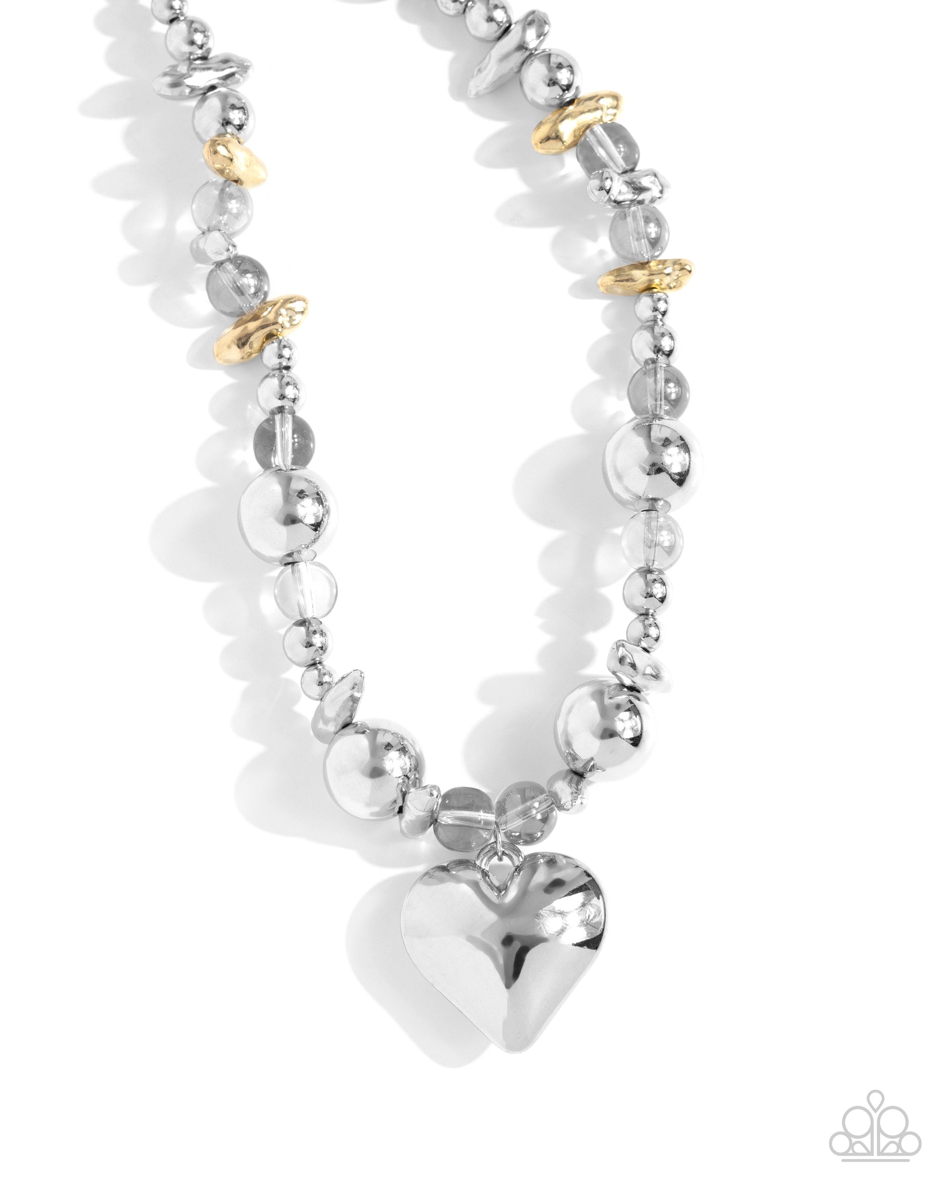 Paparazzi Accessories - Glistening Gossip - Silver Necklaces infused along an invisible string, a collection of silver beads in varying sizes, chiseled gold pebbles, and transparent gray beads loop around the neckline for a glistening display of color. An oversized silver heart pendant swings from the center of the display for a light-hearted finish. Features an adjustable clasp closure.  Sold as one individual necklace. Includes one pair of matching earrings.