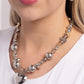 Paparazzi Accessories - Glistening Gossip - Silver Necklaces infused along an invisible string, a collection of silver beads in varying sizes, chiseled gold pebbles, and transparent gray beads loop around the neckline for a glistening display of color. An oversized silver heart pendant swings from the center of the display for a light-hearted finish. Features an adjustable clasp closure.  Sold as one individual necklace. Includes one pair of matching earrings.