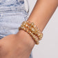 Faceted gold clear and opaque beads, various gold beads, and a vintage-embellished oversized bead stack up the wrist on elastic stretchy bands for a classically colorful look.  Sold as one set of three bracelets.