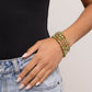 Brushed in a UV coating, reflective faceted green beads, green beads, gold beads, and white rhinestones in square fittings are threaded along a coiled wire, creating a refined infinity wrap-style bracelet around the wrist.  Sold as one individual bracelet.